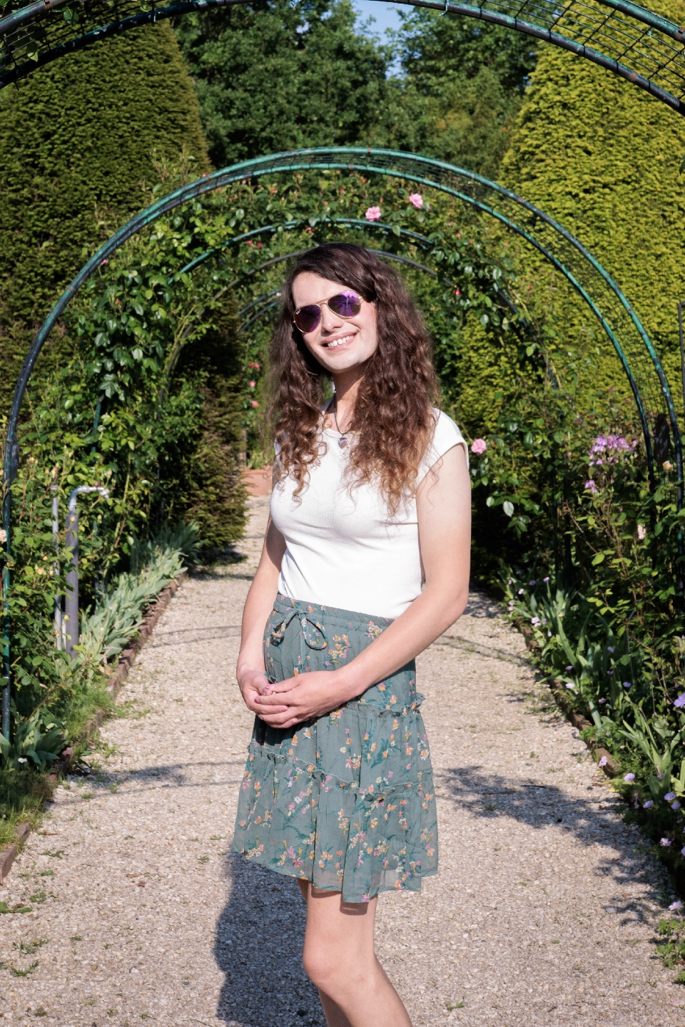 Photo of Alex Clarke in a rose garden