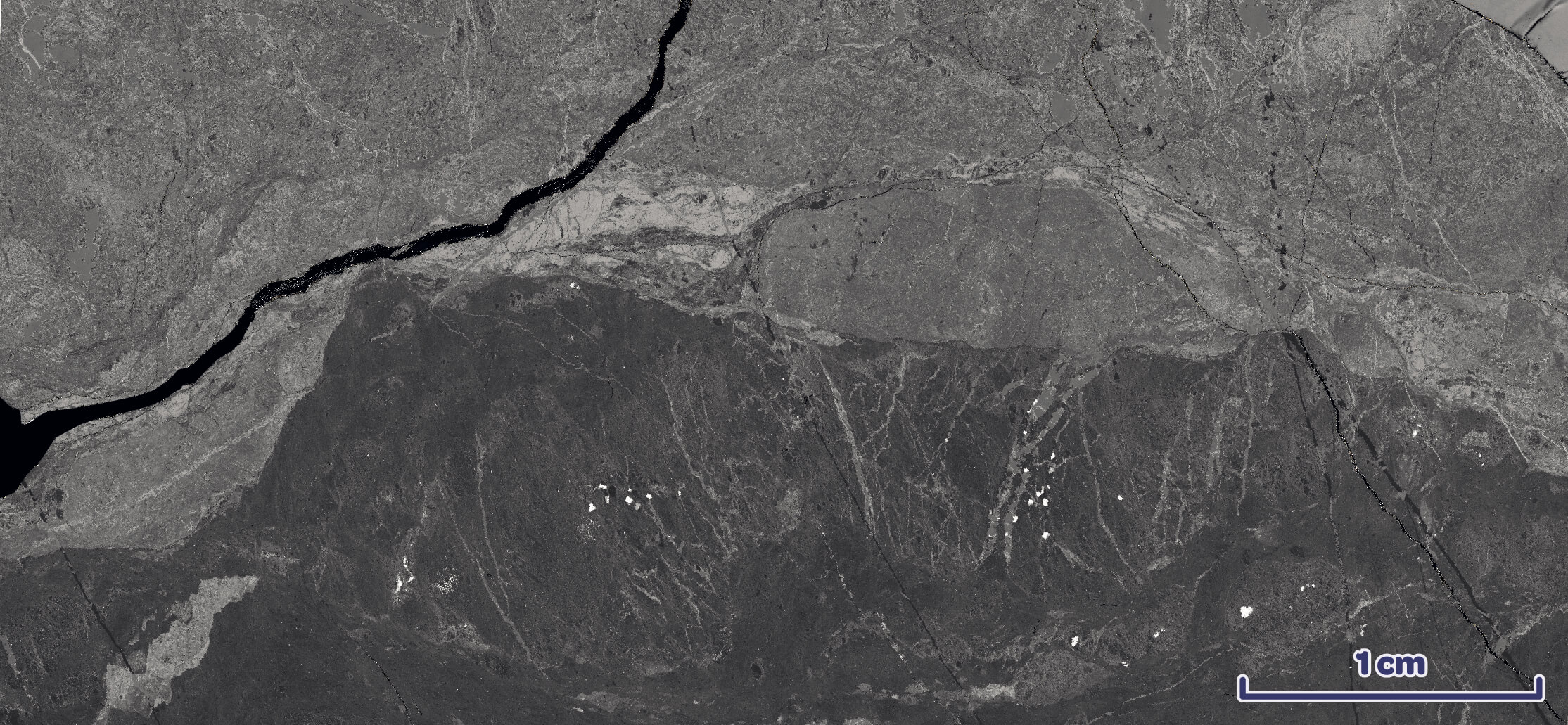Altered basalt block with brecciated texture over-printed by alteration.